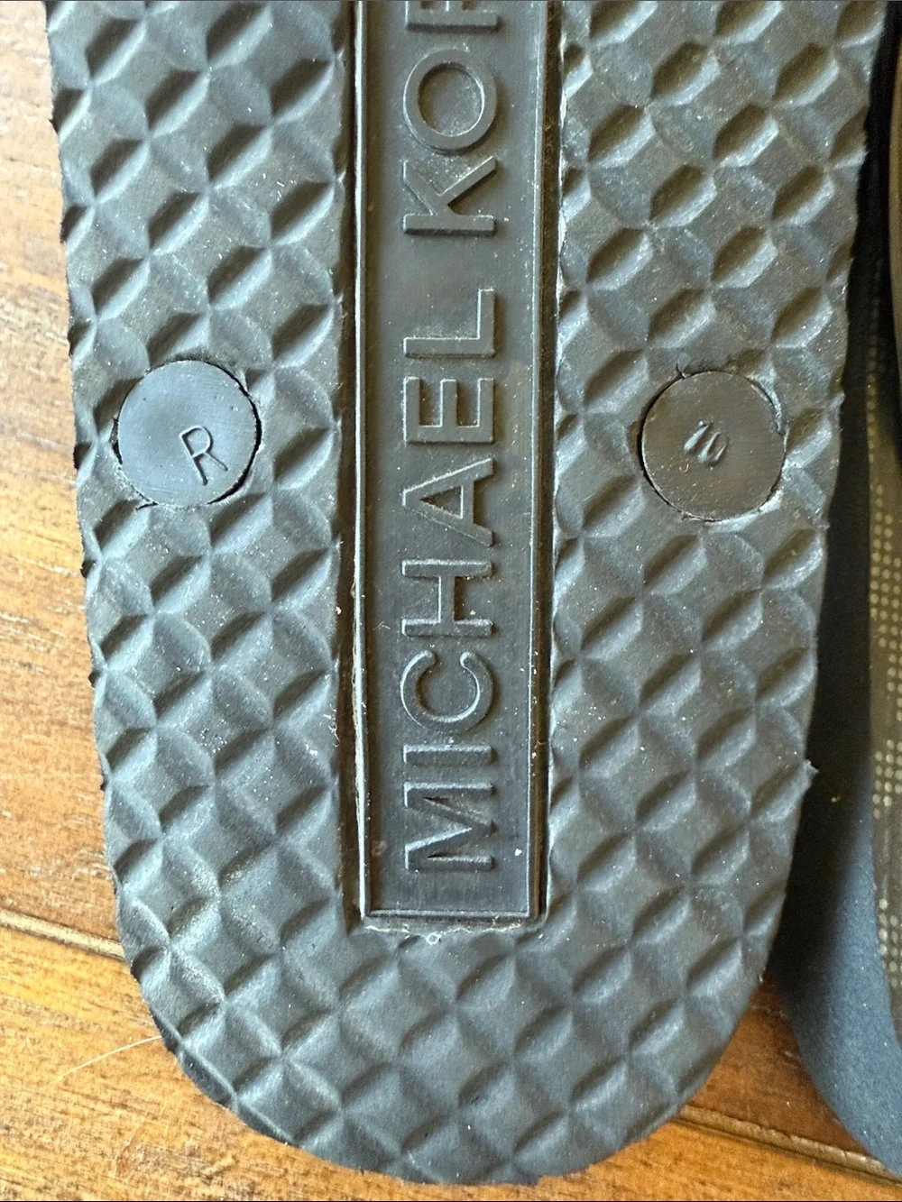 Michael Kors Black and Gold MK Logo Jelly Flip Flop Sandals